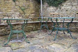 Three pierced wrought metal and painted garden tables. H.67 W.86cm (largest) (3)