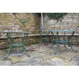 Three pierced wrought metal and painted garden tables. H.67 W.86cm (largest) (3)