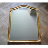 A gilt framed wall mirror with arched bevelled plate. H.90 W.70cm