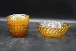 A set of seven vintage amber swirl depression glass fruit dessert bowls. H.7 Dia.20cm