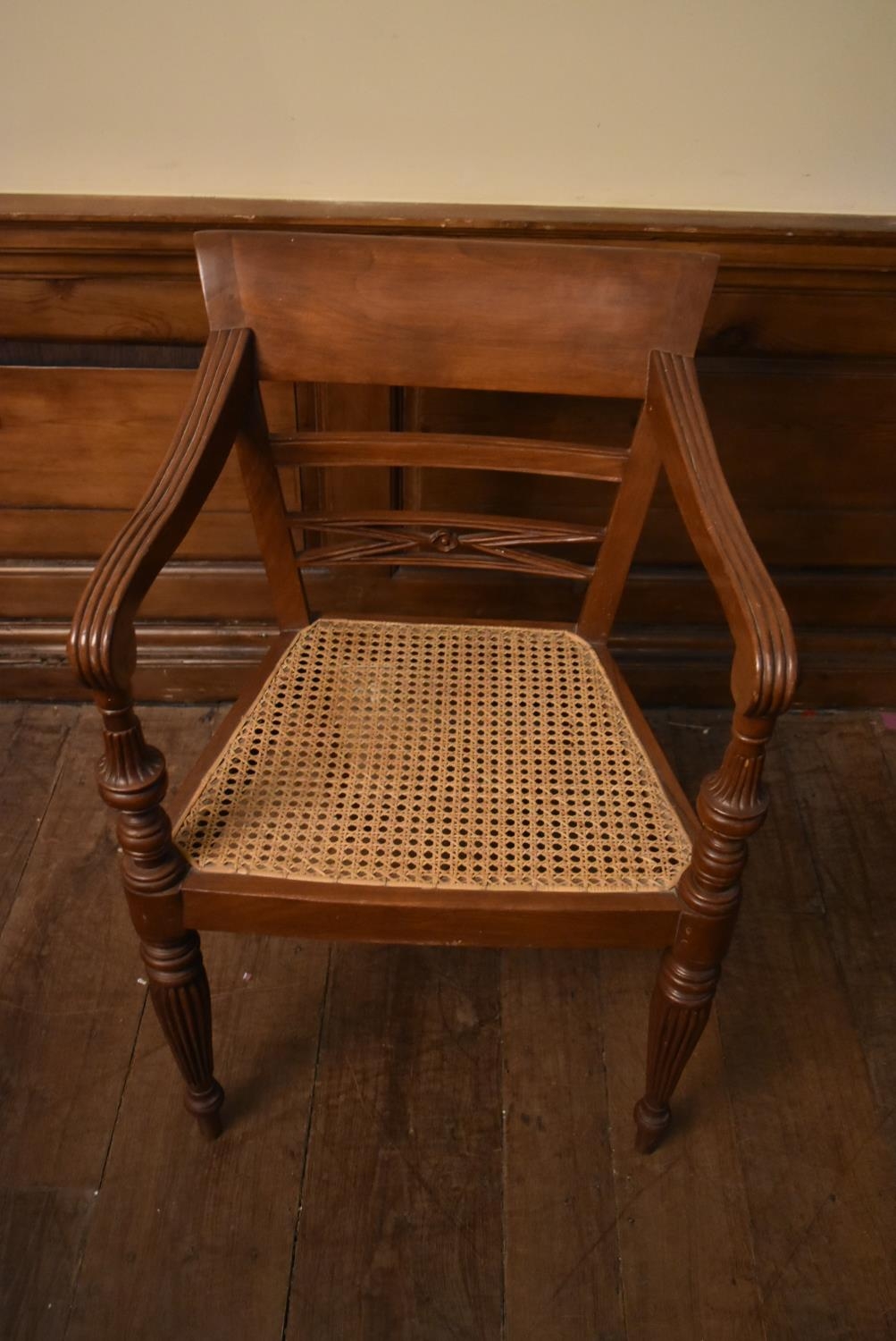 An Eastern teak Regency style open armchair with bar back above caned seat on reeded tapering - Image 7 of 9