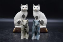 A pair of Takahashi Japan San Francisco Staffordshire cat bookend figurine statues, along with a