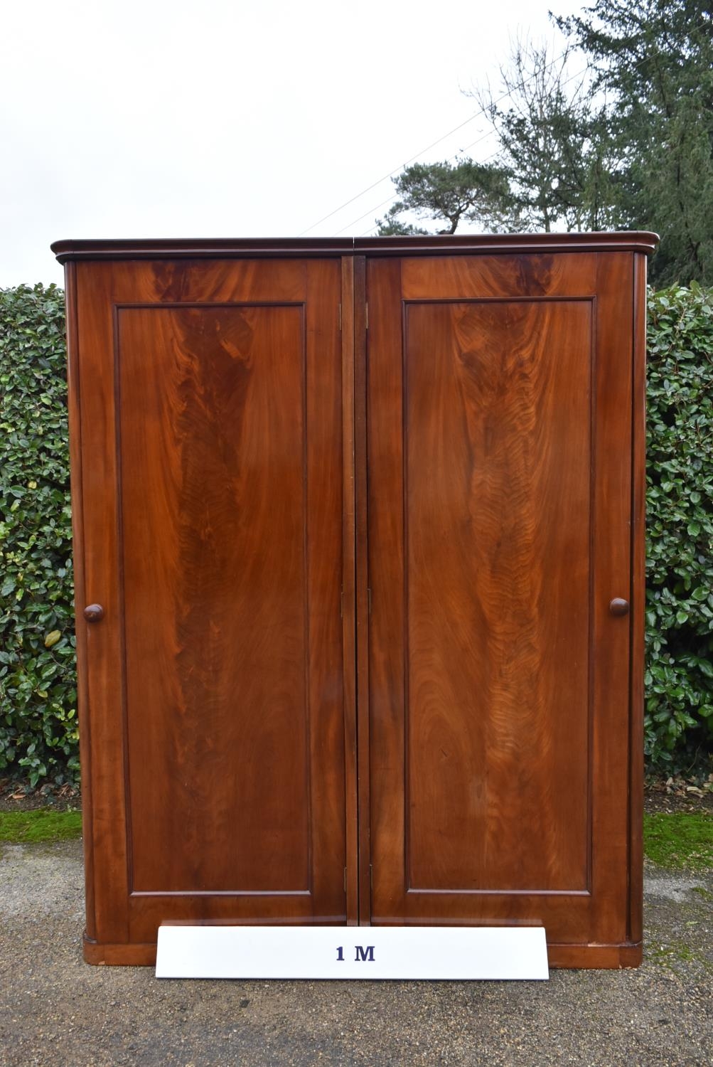 A 19th century flame mahogany two section wardrobe with panel doors enclosing full height hanging - Image 8 of 9