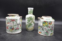 A pair of 19th century famille rose chinese ewers and an oriental vase, with handpainted floral