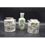 A pair of 19th century famille rose chinese ewers and an oriental vase, with handpainted floral