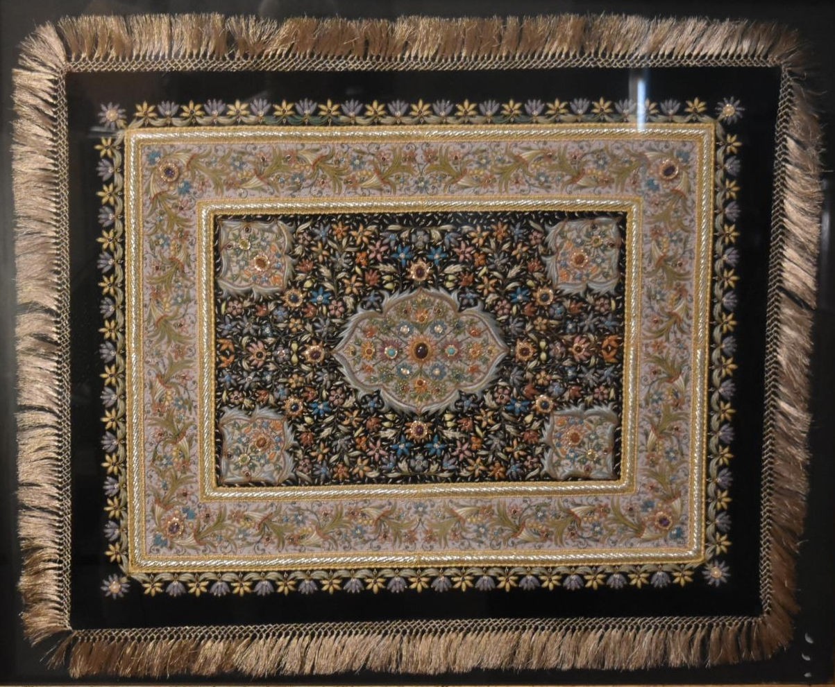 A gilt framed and glazed Persian silk rug on a black background with floral boarders. H.80 W.94cm - Image 2 of 7