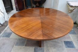 A large contemporary quarter veneered dining table. H.75 W.182cm