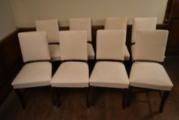A set of eight dining chairs with upholstered seats and backs on shaped cabriole supports with loose