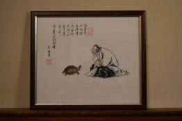 A framed and glazed Chinese ink on paper, an old man with a turtle with artist seal and chinese