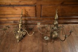 A pair of 20th century Dutch brass chandeliers with six scrolling branches mounted with sconce