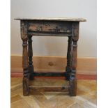 An antique oak joint stool on baluster turned stretchered supports. H.56 W.45 D.27cm