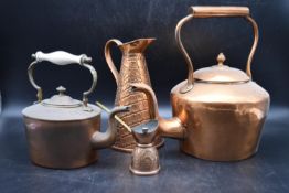 A collection of early 20th century copperware. Including two copper teapots with lids, an aligator