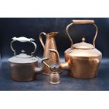 A collection of early 20th century copperware. Including two copper teapots with lids, an aligator