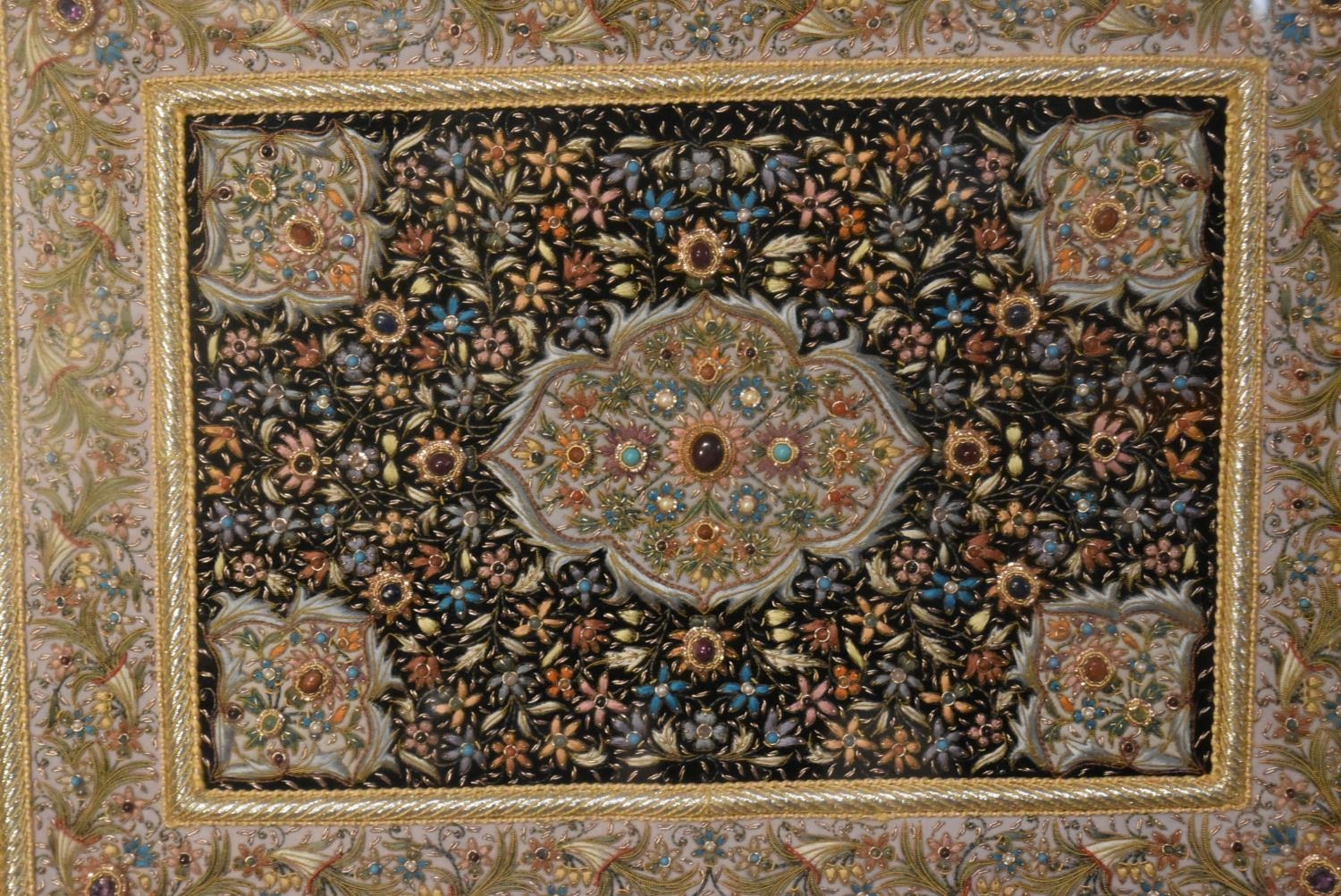 A gilt framed and glazed Persian silk rug on a black background with floral boarders. H.80 W.94cm - Image 3 of 7