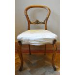 A Victorian mahogany balloon back dining chair on cabriole supports. H.85 W.46 D.40cm