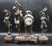 Emile Guillemin - An Art Neoveau three-piece bronze mantle clock and garnitures, titled 'Les Fee Des