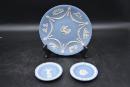 A set of three Wedgewood Jasperware plates, with a classical design and makers mark stamped to base.