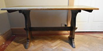 A vintage oak refectory style dining table on trestle supports. H.75 W.145 D.40cm