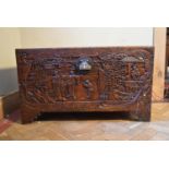 A carved Chinese camphorwood coffer. H.58 W.100 D.50cm