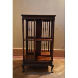 A C.1900 mahogany revolving bookcase on squat cabriole supports. H.88 W.50 D.49cm