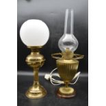 A 19th century converted duplex brass oil lamp on walnut base and one other similar with frosted