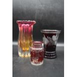 A collection of three vintage glass vases. Including an Art Deco multicoloured vase with a scalloped