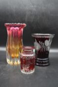 A collection of three vintage glass vases. Including an Art Deco multicoloured vase with a scalloped