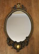 A gilt framed girandole with shell decorated cresting and twin sconces. H.90 W.50cm