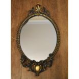 A gilt framed girandole with shell decorated cresting and twin sconces. H.90 W.50cm