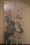 A Chinese watercolour on silk, peonies and foliage. H.120 W.60cm (Perspex protection)