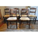 A set of six 19th century oak bar back dining chairs with woven rush seats on turned stretchered