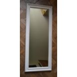 A wall mirror in white painted moulded frame and a similar mirror. H.135 W.54cm