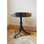 A 19th century satinwood and mahogany crossbanded drum table on reeded swept tripod supports. H.72
