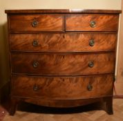 A Georgian flame mahogany bow fronted chest on swept bracket supports., H.107 W.109 D.52cm