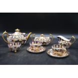 A part set of a handpainted Crown Derby - Old Imari Teaset. Including two cups and saucers, milk