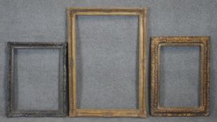 Three antique carved wooden foliate design picture frames, one with a metal effect. Rebate H.62 W.