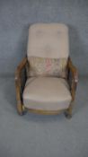 A vintage oak armchair with caned sides and fully reclining sliding action.