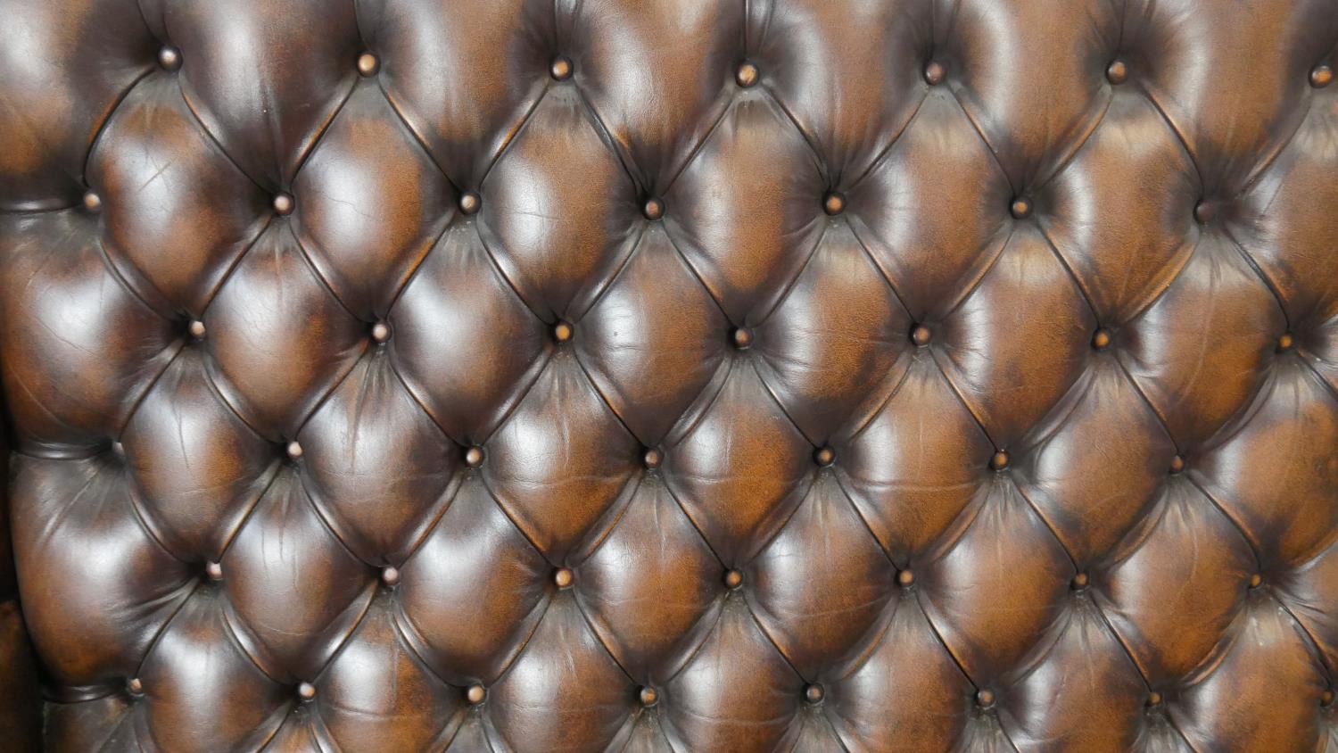 A Georgian style wingback two seater armchair in deep buttoned and studded leather upholstery on - Image 4 of 5