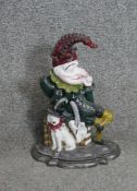 A Mr Punch painted cast iron doorstop.