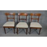 A pair of 19th century bar back dining chairs and a similar chair all in the same upholstery.