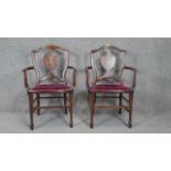 A pair of late 19th century rosewood salon armchairs with profuse satinwood urn and husk swag inlay.