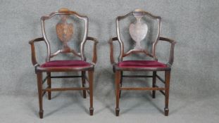 A pair of late 19th century rosewood salon armchairs with profuse satinwood urn and husk swag inlay.