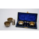 A collection of Victorian silver salts. Including a leather cased set of floral design silver