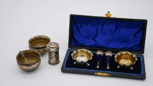 A collection of Victorian silver salts. Including a leather cased set of floral design silver