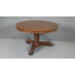 A 19th century mahogany tilt top dining table on inverted facetted base. h70 d122