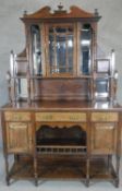 A late 19th century rosewood and satinwood strung mirror backed sideboard with display cabinet to