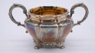 An early Victorian twin handled gourd design silver sugar bowl with foliate design handles and