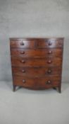 A Georgian mahogany chest with shaped apron on swept bracket supports. h117 w106 d55