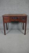 A Georgian mahogany lowboy on square chamfered supports. H.71 W.83 D.48cm