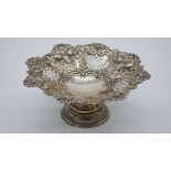 A Victorian repousse pierced silver pedestal bonbon dish by Deakin and Francis with fruit, floral